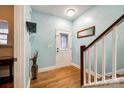 Welcoming entryway with hardwood floors, stairs to the upper level, and decorative details at 5664 Norwood Ridge Dr, Rock Hill, SC 29732