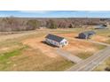 Wide aerial shot of two pristine homes in a spacious, natural landscape, showcasing a serene and open environment at 603 Mt. Wesley Church Rd, Hiddenite, NC 28636
