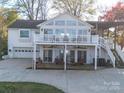 Spacious backyard featuring a two-level deck, perfect for outdoor entertaining with lake views at 925 Lanier Ln, Monroe, NC 28110