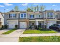 Townhome with a garage, manicured lawn, and a walkway leading to the entrance at 1066 Chicory Trce, Lake Wylie, SC 29710