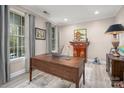 Bright office with hardwood floors, natural light, and neutral color palette at 10823 Preservation Park Dr, Charlotte, NC 28214