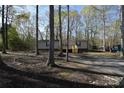 Home exterior with well-kept lawn and landscaping at 121 Silver Fox Ct, Mount Holly, NC 28120