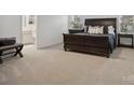 Spacious bedroom features neutral carpet and en-suite bathroom at 124 Benford Dr, Troutman, NC 28166
