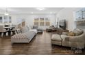 Bright living room with hardwood floors, natural light, and stylish furnishings at 124 Benford Dr, Troutman, NC 28166