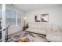 Bright living room featuring neutral tones and ample natural light at 15212 Keyes Meadow Way, Huntersville, NC 28078