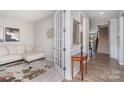 Cozy living room adjacent to entryway with seamless transition at 15212 Keyes Meadow Way, Huntersville, NC 28078