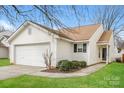 Exterior view of home with vinyl siding, window, and manicured lawn at 1671 Sandpiper Dr, Rock Hill, SC 29732
