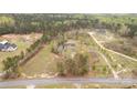Expansive aerial view of a secluded home nestled among lush greenery and mature trees at 1853 Beach Ln, Heath Springs, SC 29058