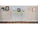 Elegant front door with decorative glass and sidelights, creating a bright and inviting entry at 235 Stafford Estates Dr, Salisbury, NC 28146