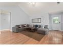 Comfortable living room featuring a sectional sofa and wood flooring at 4020 Brandie Glen Rd, Charlotte, NC 28269