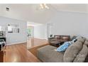 Open living room with hardwood floors, vaulted ceiling, and ample natural light at 4020 Brandie Glen Rd, Charlotte, NC 28269