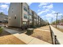 Street view of modern townhomes with diverse exterior finishes and well-maintained front yards at 532 Billingsley Rd, Charlotte, NC 28211