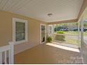 Inviting covered porch perfect for enjoying quiet mornings or evenings at 61 Brown Sw St, Concord, NC 28027