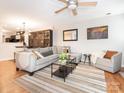 Comfortable living room filled with natural light, hardwood flooring, and stylish furnishings at 753 Mountainwater Dr, Charlotte, NC 28262