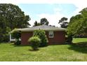 Brick home with mature trees offering a serene and private setting at 8608 Cedarbrook Dr, Charlotte, NC 28215