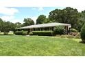 Well-maintained brick home featuring lush lawn and landscaping for great curb appeal at 8608 Cedarbrook Dr, Charlotte, NC 28215