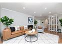 Bright living room features a fireplace, and an open concept design at 900 E Woodlawn Rd, Charlotte, NC 28209