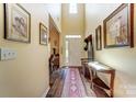 A bright entryway with tall ceilings and a beautiful hardwood floors at 10421 Dominion Village Dr, Charlotte, NC 28269