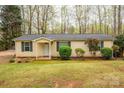 Charming single-story home featuring a well-maintained lawn and inviting entrance at 113 Hidden Ln, Mooresville, NC 28117