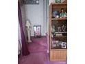 Hallway with plush carpeting, decorative furniture, and built-in shelving at 160 17Th Street Nw Pl # 3E, Hickory, NC 28601
