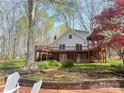 Charming home with large deck, brick accents, and mature trees in a serene setting at 245 Clontz Hill Rd, Troutman, NC 28166