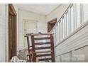 Entry hall featuring a staircase and a chair at 303 E Fisher St, Salisbury, NC 28144