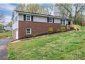 Split-level home with brick facade, new mulch, and a lush front lawn at 3791 Richard St, Claremont, NC 28610