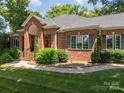 Classic brick home with manicured landscaping and mature trees at 3964 Deer Run Ne Dr, Conover, NC 28613