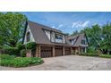 Spacious three-car garage with Tudor-style architecture and ample parking at 418 3Rd Ne St, Hickory, NC 28601