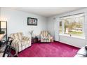 Bright living room with comfortable seating, window, and decorative accents at 4603 Oakwood Cir, Gastonia, NC 28056