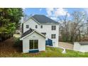 A two-story home with a deck and a finished basement, and a detached sun room in the rear at 5680 Gold Creek Bay None, Hickory, NC 28601