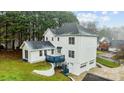 A two-story home with a deck and a finished basement with a garage in the rear at 5680 Gold Creek Bay None, Hickory, NC 28601
