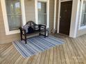 Inviting front porch with a cozy bench, rug, and decorative accents at 637 Williamson Rd # 304, Mooresville, NC 28117