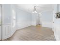 Bright dining room with wainscoting, modern gray flooring, and a stylish chandelier fixture at 1386 21St Ne Ave, Hickory, NC 28601