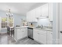 Well-lit kitchen with white cabinetry, stainless steel appliances, and durable countertops at 1386 21St Ne Ave, Hickory, NC 28601