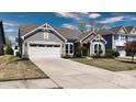 Two-story home featuring a wide driveway and well-maintained landscaping at 1495 Imperial Ct, York, SC 29745