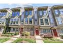 Modern townhome exterior with large windows, stylish trim, and well-maintained landscaping on a sunny day at 1617 Cannon View Ln, Charlotte, NC 28208