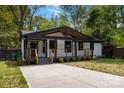 Charming bungalow with a covered porch, black trim, and freshly painted white brick at 1812 Lot 2 Anderson St, Charlotte, NC 28205