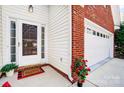 Inviting front door and walkway lead to a two-car garage at 2020 Makin Dr, Indian Trail, NC 28079