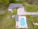 Expansive aerial view showcasing the inviting in-ground pool and well-manicured surrounding landscape of the home at 3452 Flat Creek Rd, Lancaster, SC 29720