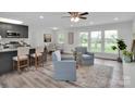 Bright open concept living space with modern furnishings, island, and a dining area at 3452 Flat Creek Rd, Lancaster, SC 29720