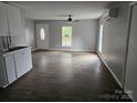 Open floor plan with hard wood flooring and plenty of natural light at 411 Weathers St, Shelby, NC 28150