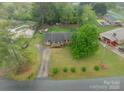 Aerial view showcasing the house, long driveway, and lush landscaping at 417 Donna Ave, Gastonia, NC 28052