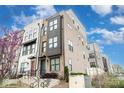 Townhome exterior with mixed materials, stepped entrances, and a contemporary urban design at 631 W Tremont Ave, Charlotte, NC 28203