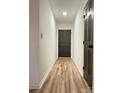 Bright hallway with modern floors leads to the main living areas of the home at 715 21St Ne Ave, Hickory, NC 28601
