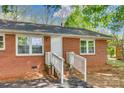 Close up of front of brick home showing entrance with white door and small brick staircase at 764 Emorywood Ln, Rock Hill, SC 29730