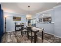 Elegant dining room featuring stylish decor, modern lighting, and an open view to the kitchen at 7790 Caswell Rd, Stanley, NC 28164