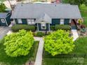 Aerial view of the property, featuring a well-maintained roof, verdant landscaping, and inviting walkway at 803 Catawba St, Belmont, NC 28012