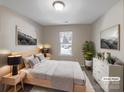 Serene bedroom features neutral decor, plush bedding, natural light, and decorative artwork at 808 Raindrops Rd, Gastonia, NC 28054