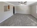 Spacious living room featuring wood floors, neutral wall colors, large windows and natural light at 808 Raindrops Rd, Gastonia, NC 28054